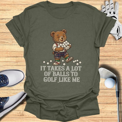 T-shirt with cartoon bear holding golf balls and text "IT TAKES A LOT OF BALLS TO GOLF LIKE ME".