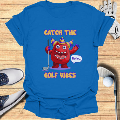 Cartoon monster saying "Hello..." with a golf club on a blue t-shirt.
