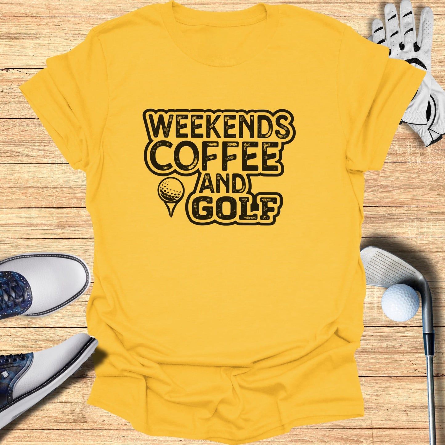Yellow t-shirt with "Weekends Coffee and Golf" graphic, golf shoes, and ball.