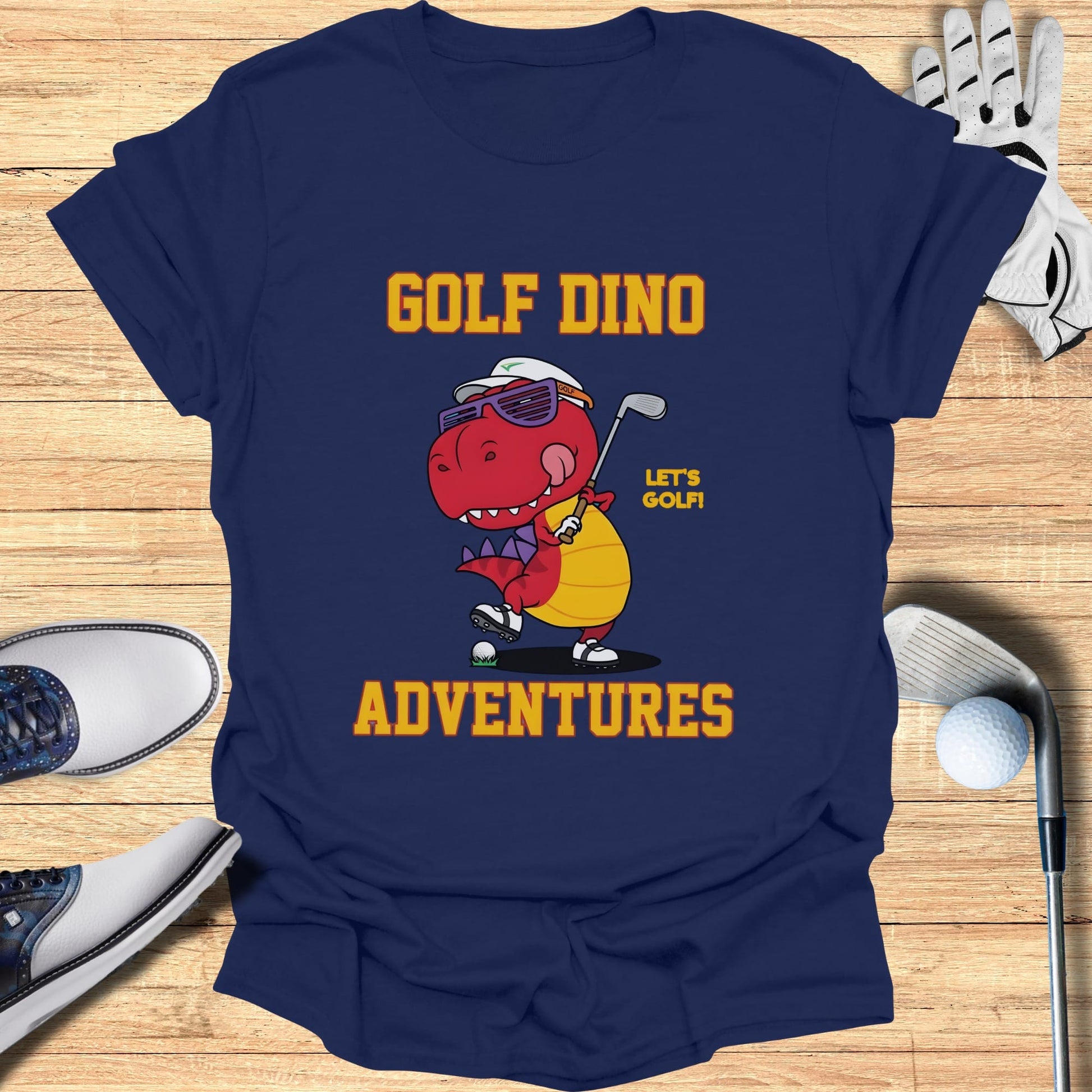 T-shirt with cartoon dinosaur golfing, "Golf Dino Adventures" text.