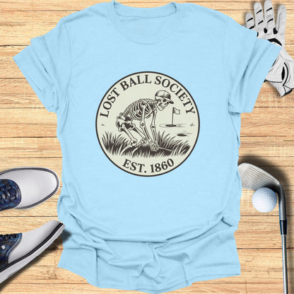 Light blue t-shirt with "Lost Ball Society Est. 1860" skeleton golf logo.