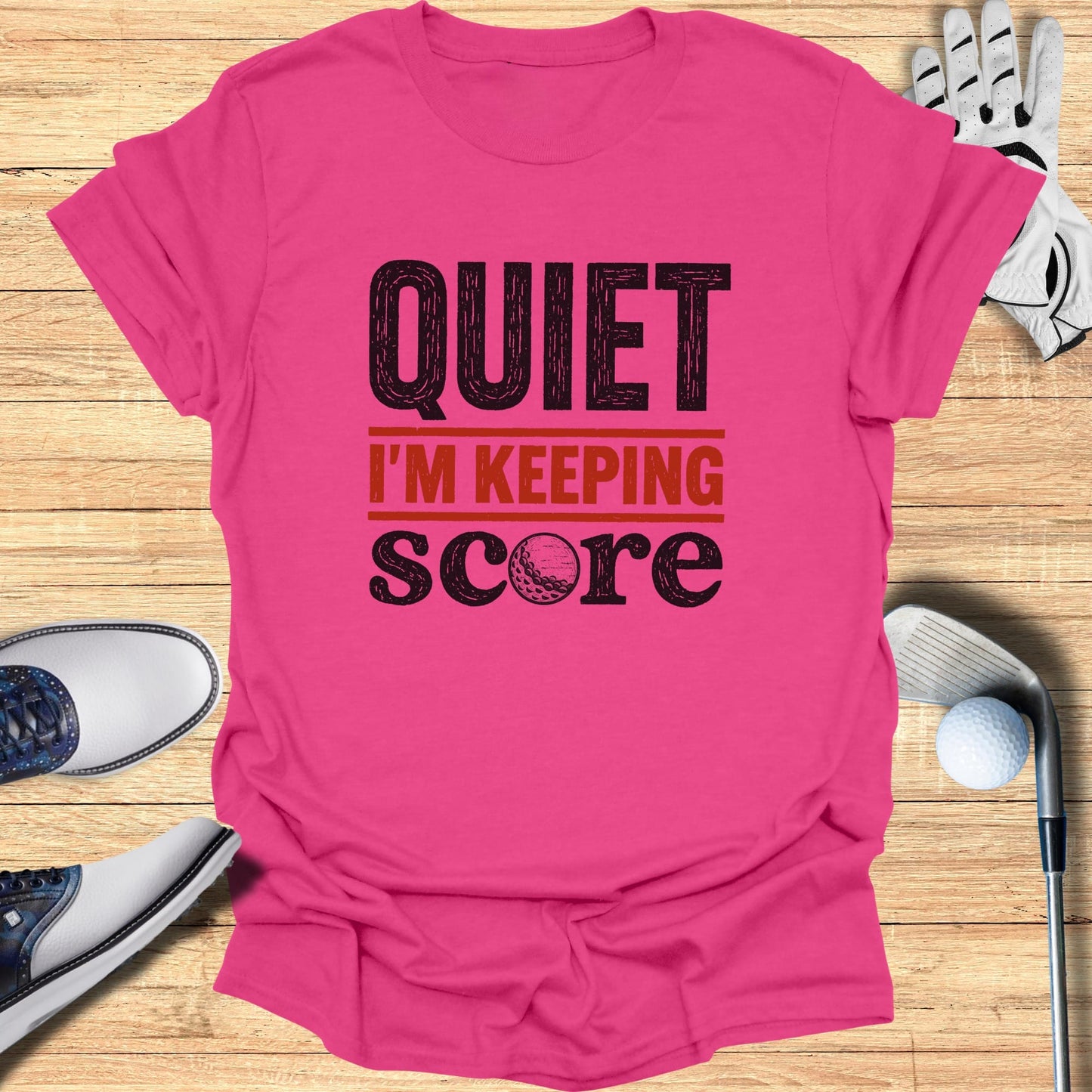 Pink t-shirt with "QUIET I'M KEEPING SCORE" and a golf ball graphic.