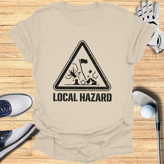 T-shirt with a black triangle hazard symbol depicting a golf hazard.