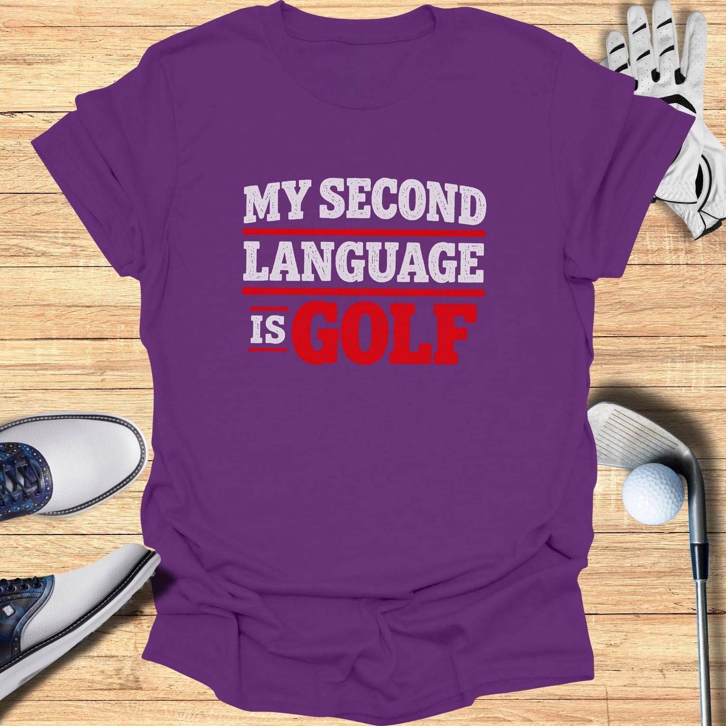 Purple t-shirt with "MY SECOND LANGUAGE IS GOLF" in white and red text.