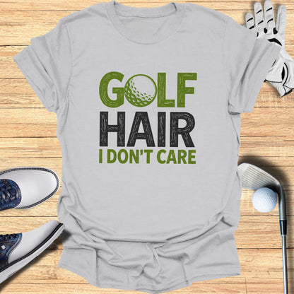 T-shirt with "GOLF HAIR I DON'T CARE" text and golf accessories.