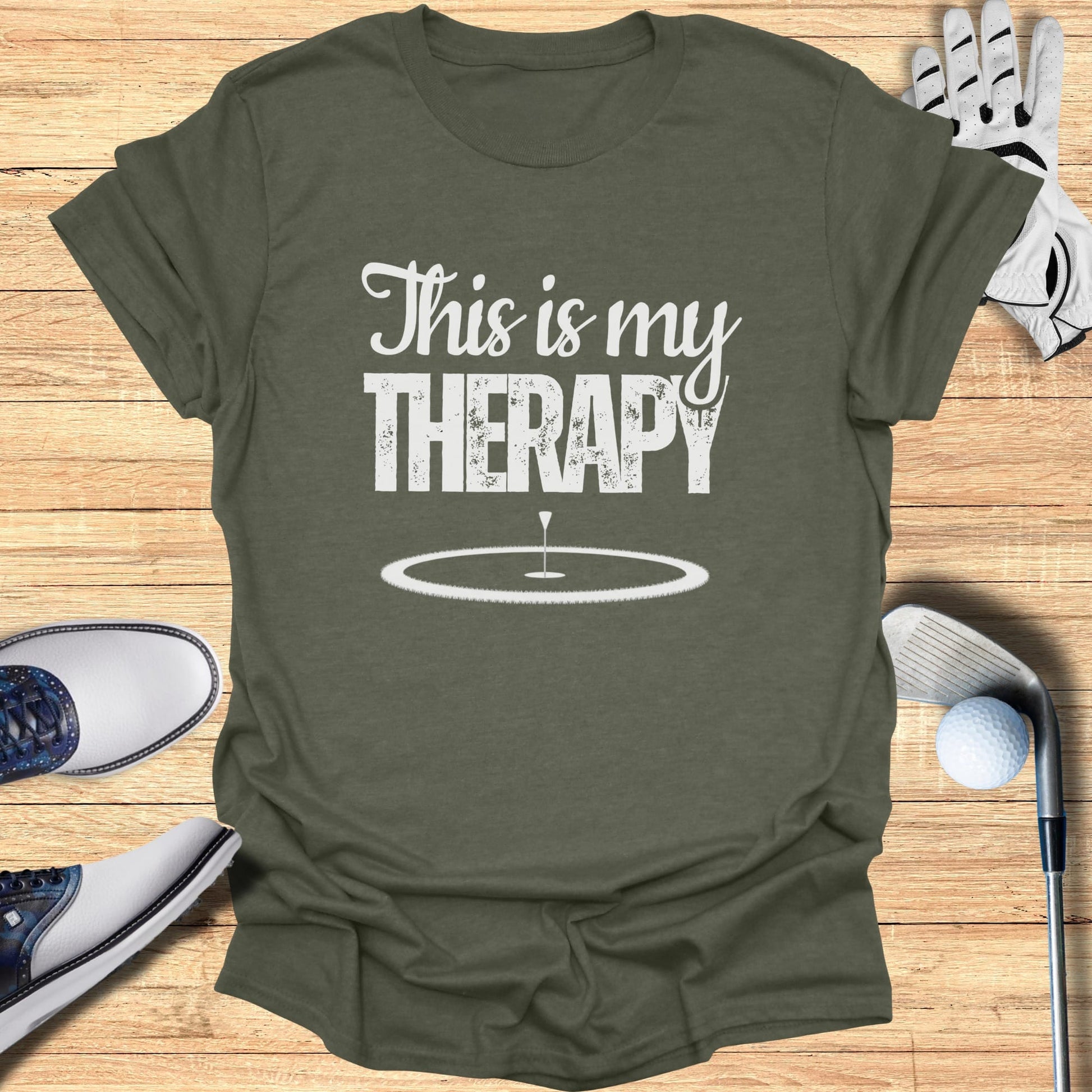 Green t-shirt with "This is my THERAPY" and a golf hole design.