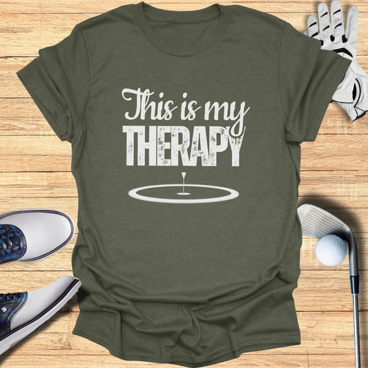 Green t-shirt with "This is my THERAPY" and a golf hole design.