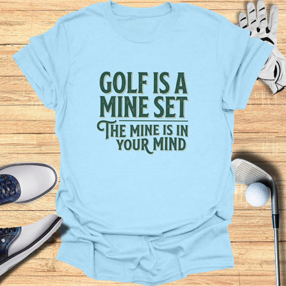 Light blue t-shirt with "Golf is a mine set, the mine is in your mind" text.