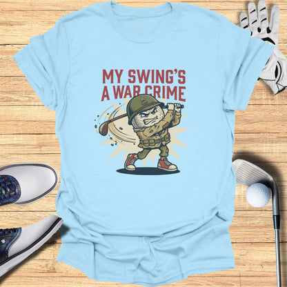 Light blue t-shirt with cartoon soldier golfer and text "MY SWING'S A WAR CRIME".