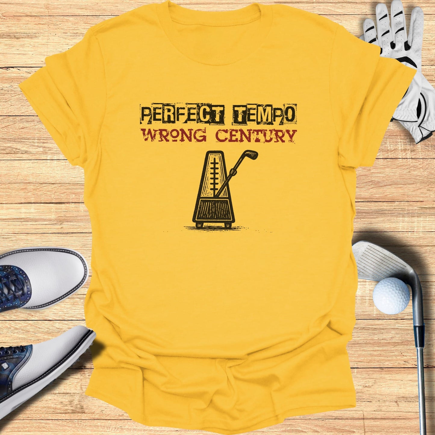 Yellow t-shirt with "PERFECT TEMPO WRONG CENTURY" text and metronome graphic.