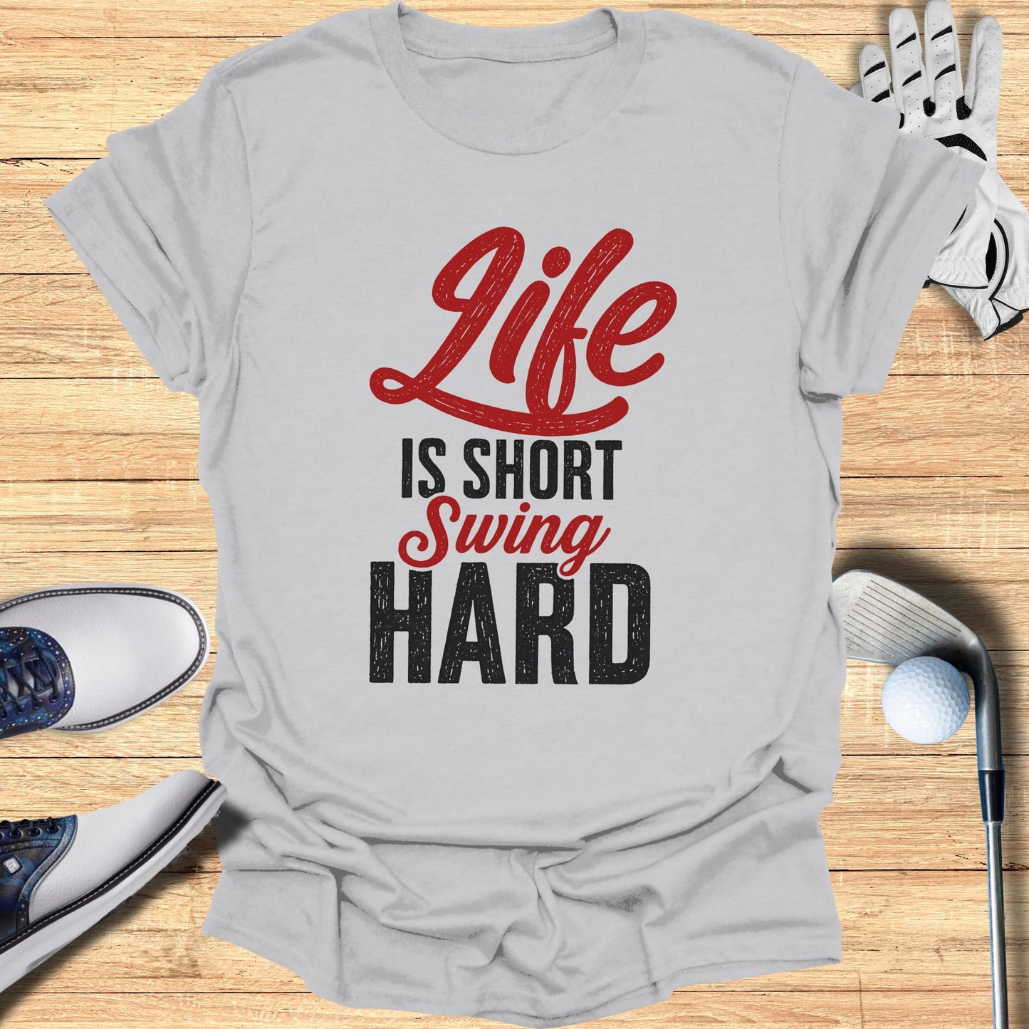 T-shirt with "Life Is Short Swing Hard" text, golf clubs, and shoes.