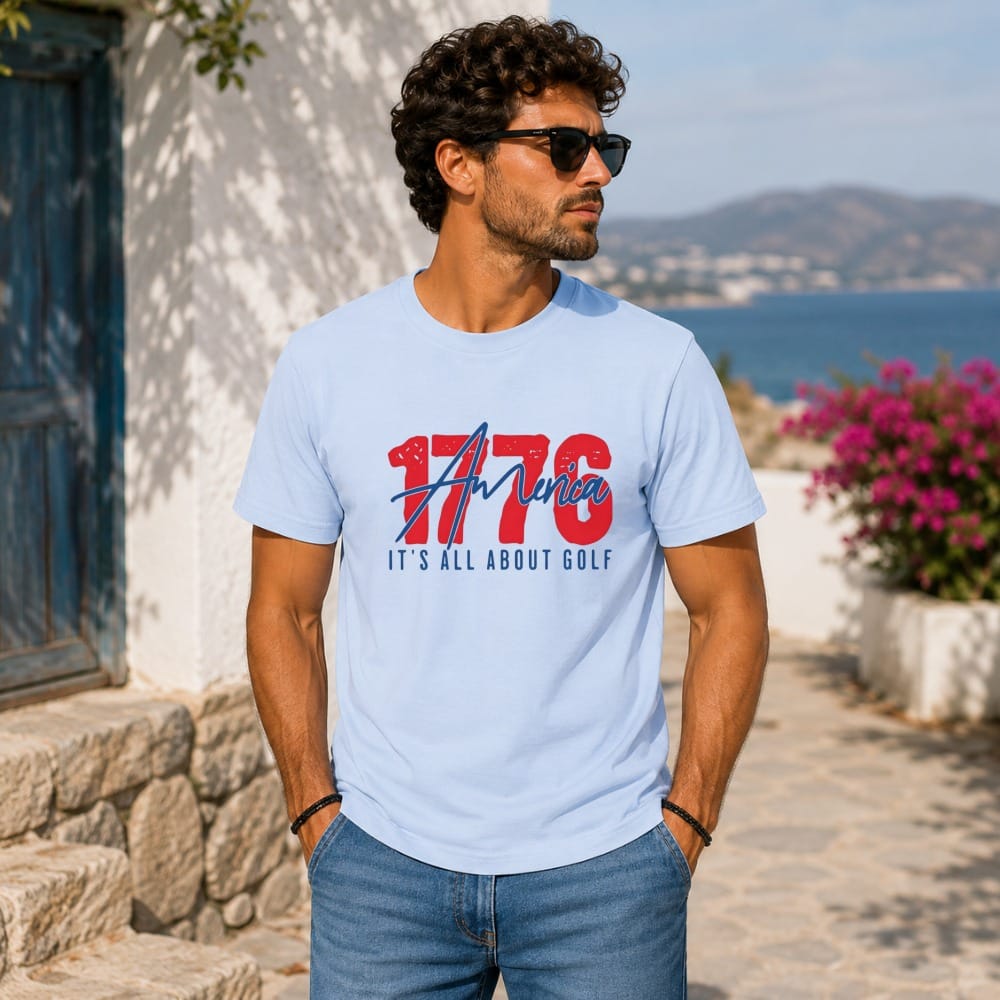 Man in light blue t-shirt with "1776 It's All About Golf" graphic.