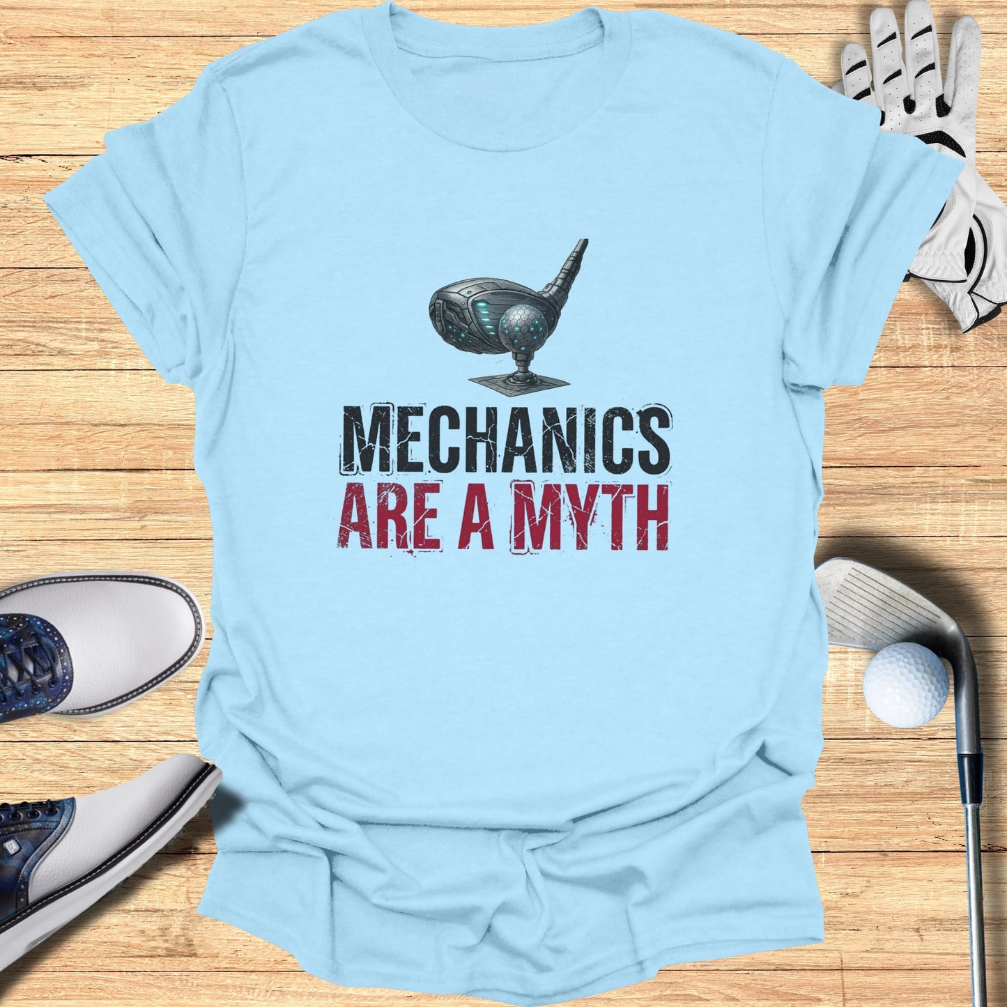 Light blue t-shirt with "Mechanics Are a Myth" text and a golf club head graphic.