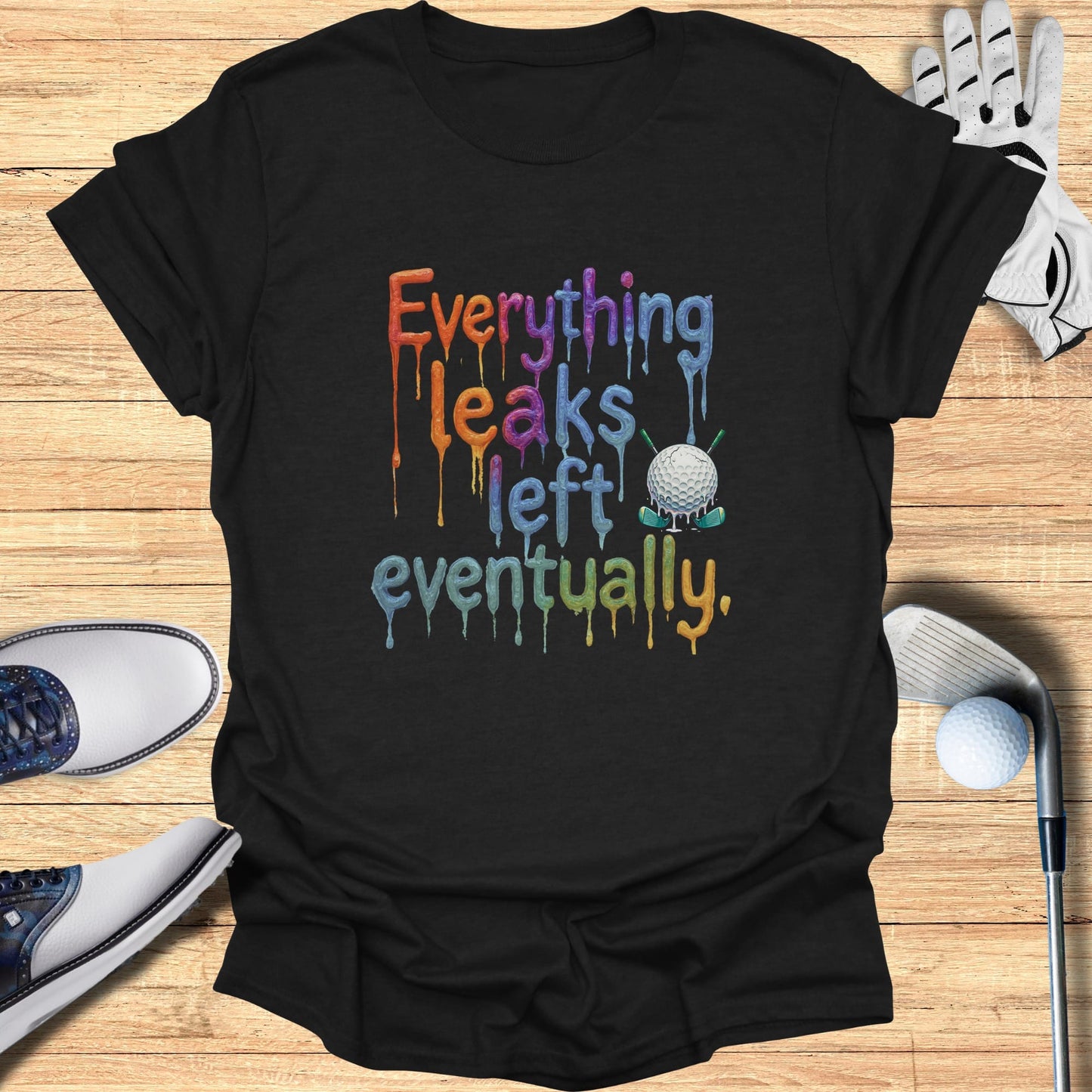 Black t-shirt with colorful "Everything Leaks Eventually" text and golf elements.