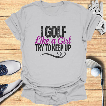T-shirt with "I Golf Like a Girl Try to Keep Up" text.