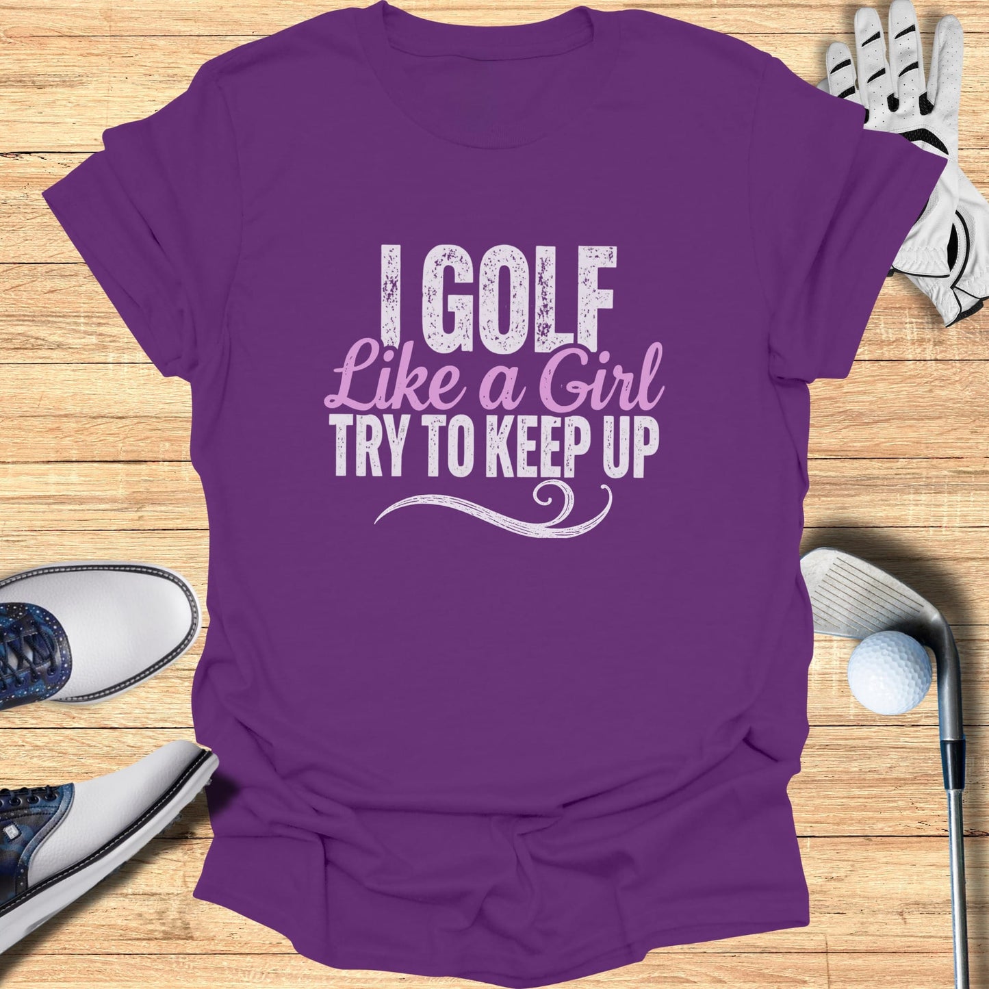 Purple t-shirt with "I GOLF LIKE A GIRL TRY TO KEEP UP" text.