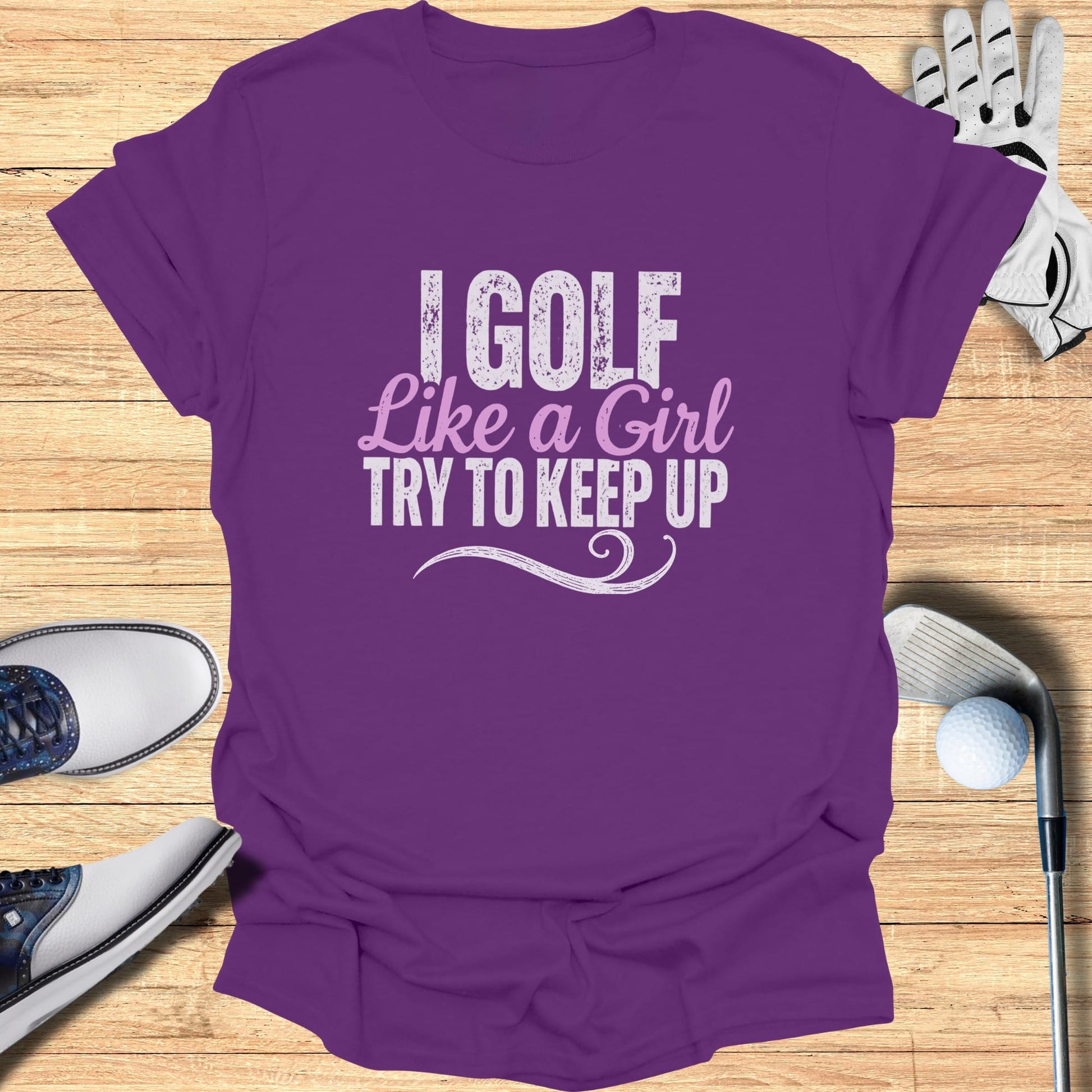 Purple t-shirt with "I GOLF LIKE A GIRL TRY TO KEEP UP" text.