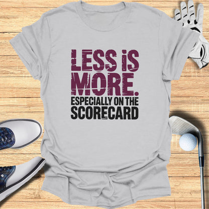 Grey t-shirt with "LESS IS MORE. ESPECIALLY ON THE SCORECARD." text.