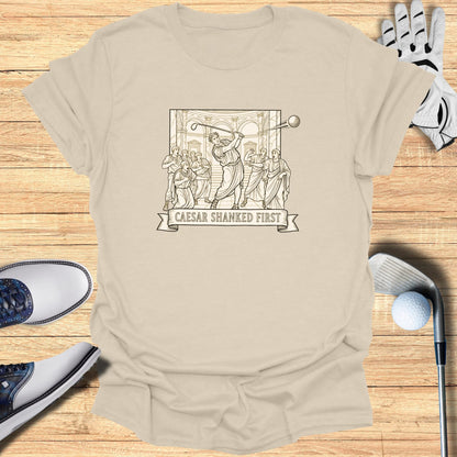 T-shirt with "Caesar Shanked First" text and a Roman-themed golf illustration.