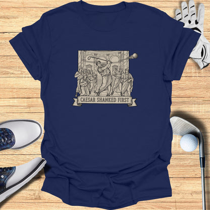 Navy t-shirt featuring a Roman-themed graphic with text "CAESAR SHANKED FIRST".