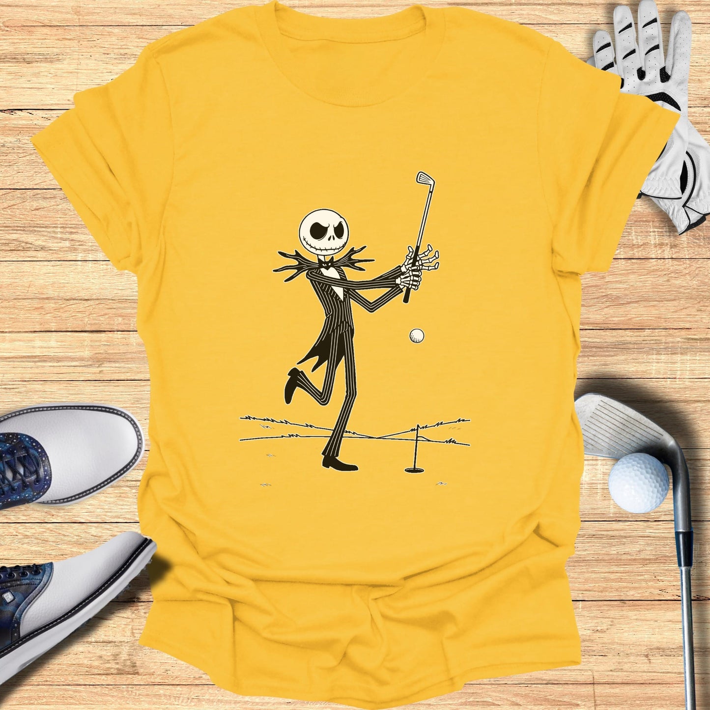 Jack Skellington swings a golf club with a ball and hole on a tee.