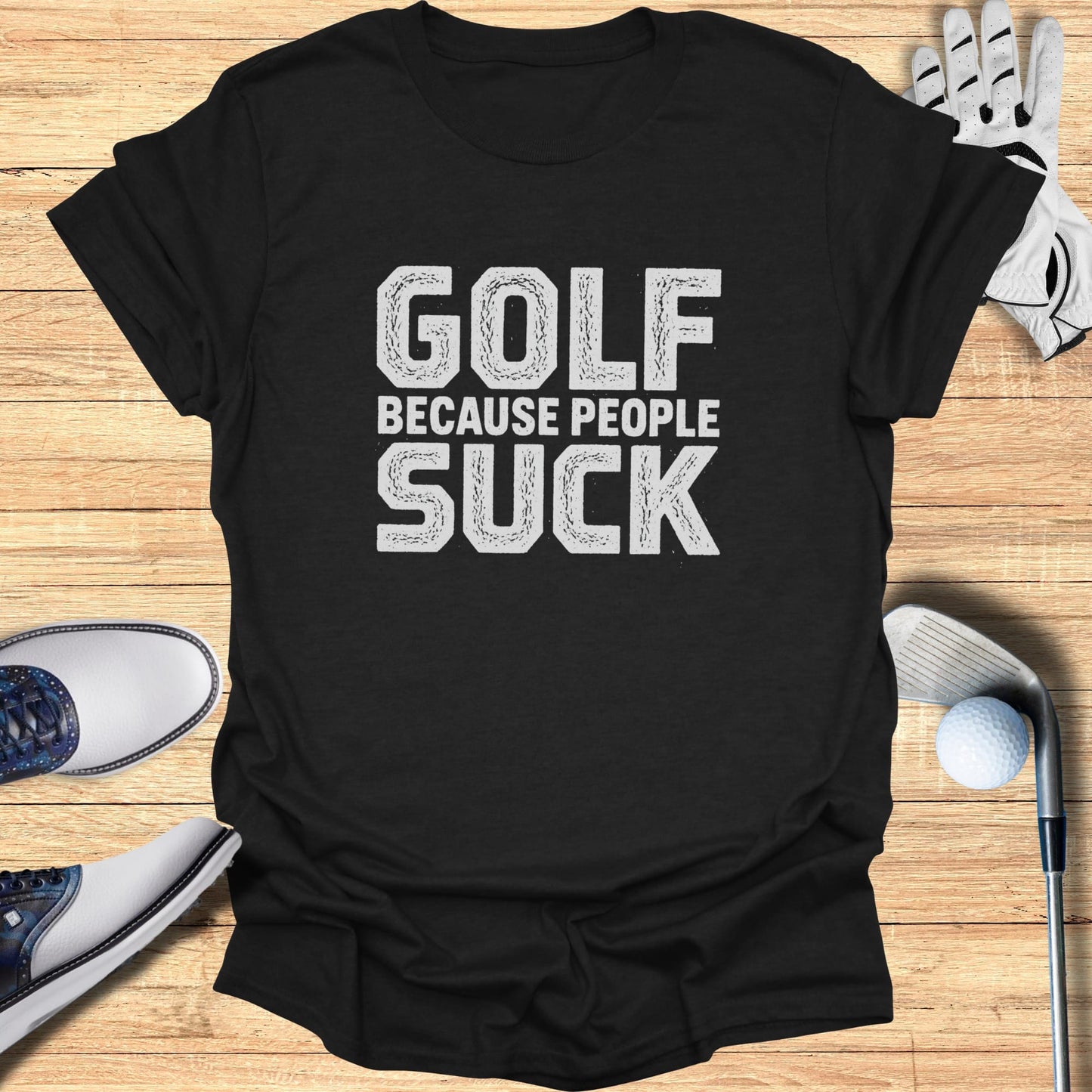 Black t-shirt with "GOLF BECAUSE PEOPLE SUCK" in white distressed text.