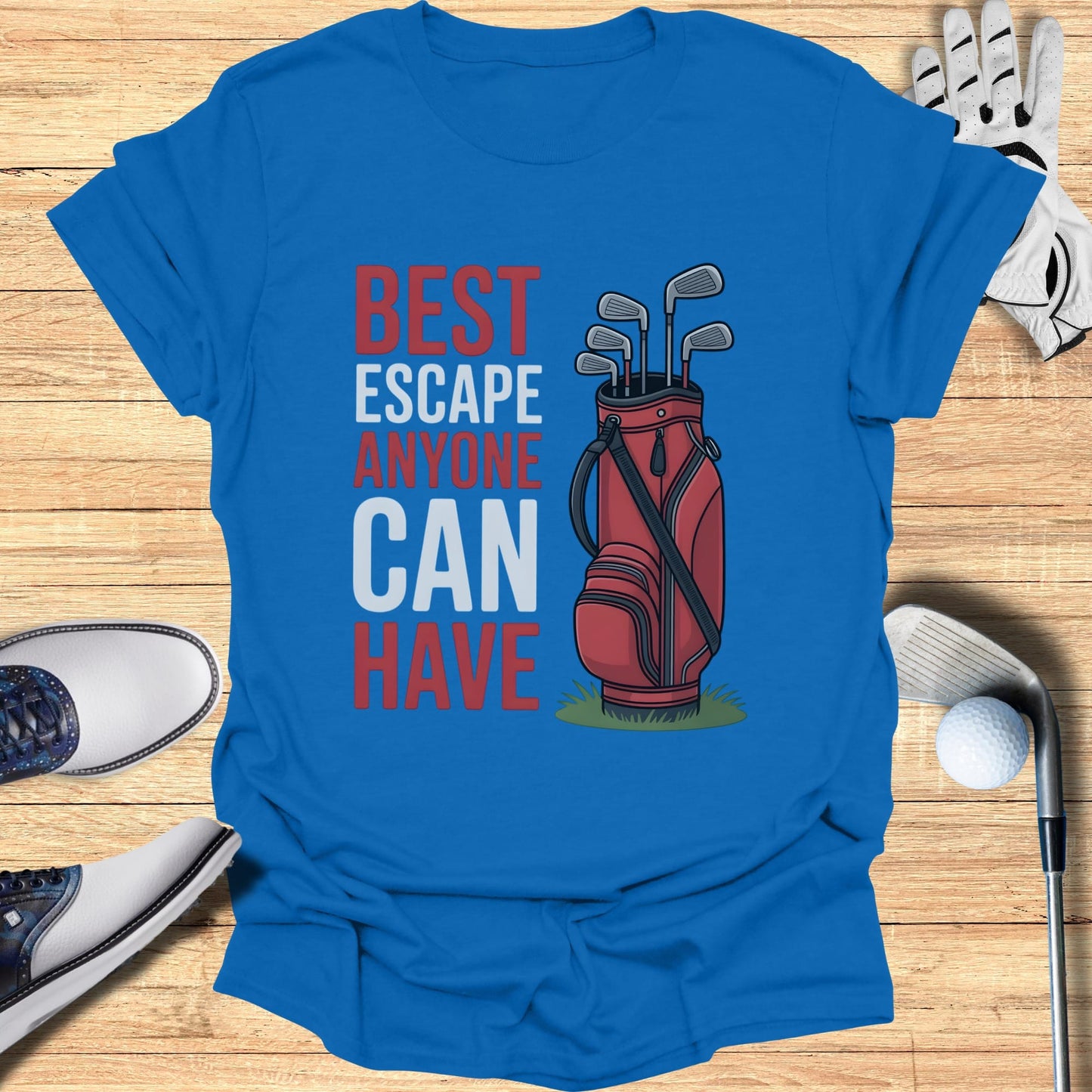 Blue t-shirt with red text "BEST ESCAPE ANYONE CAN HAVE" and golf bag graphic.