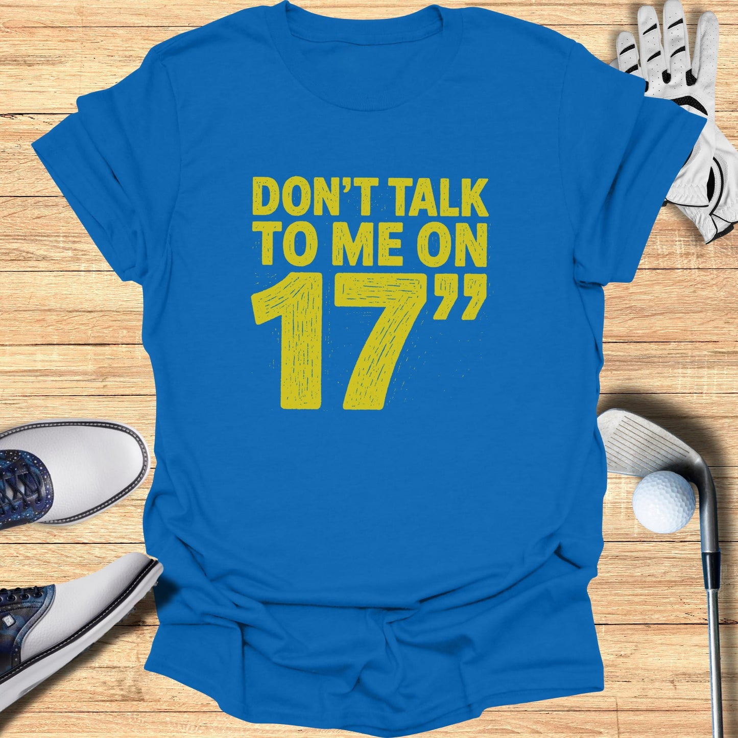 Blue t-shirt with yellow text "DON'T TALK TO ME ON 17".