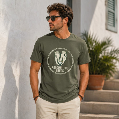 Man wearing olive t-shirt with "Reading the Break" golf graphic.