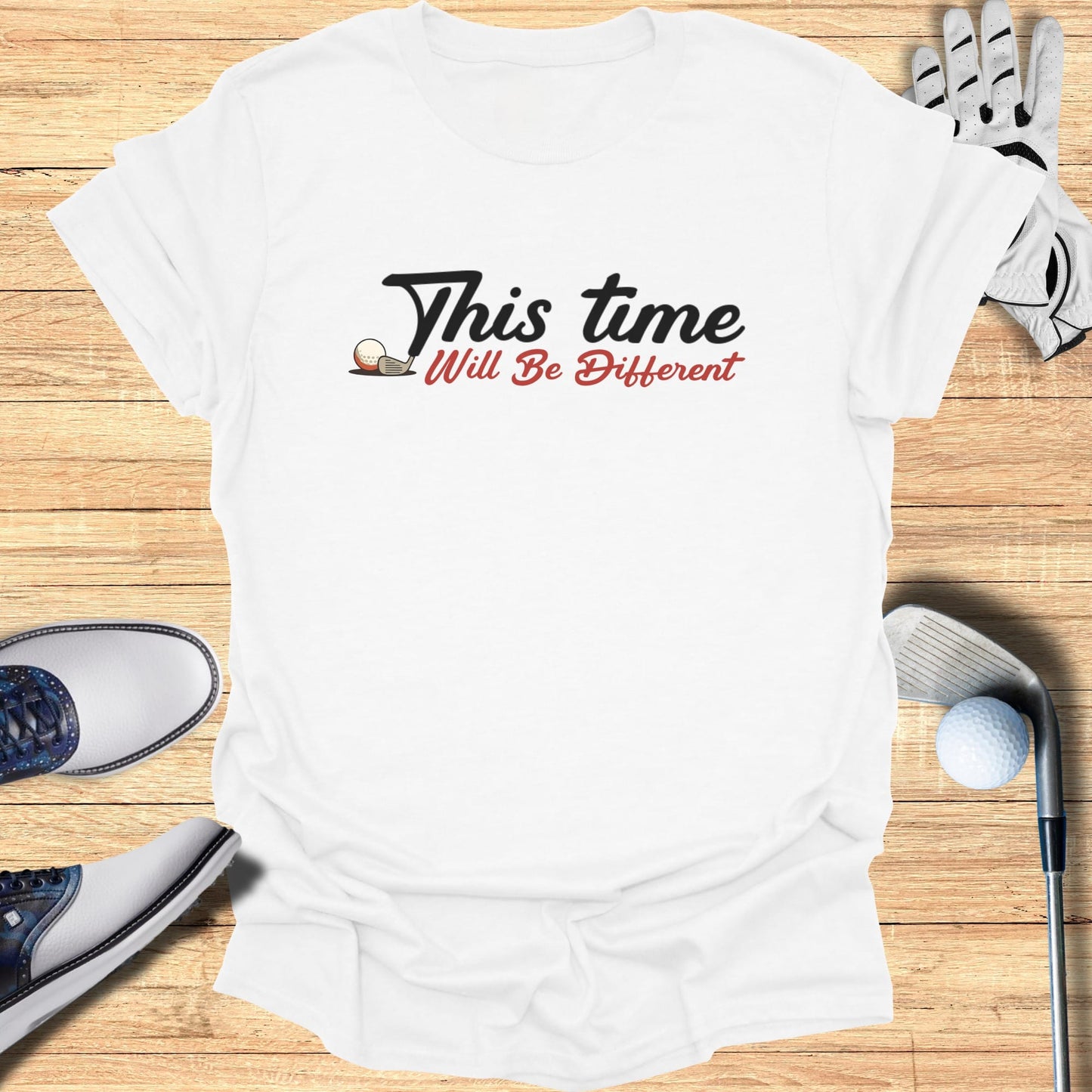 White t-shirt with "This time Will Be Different" and golf ball graphic.