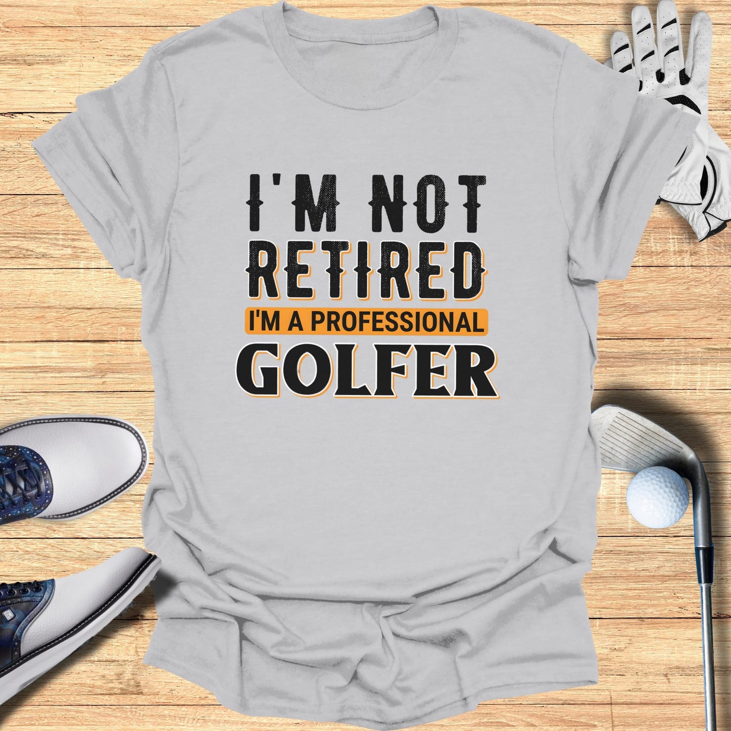 T-shirt with "I'm Not Retired, I'm a Professional Golfer" text.