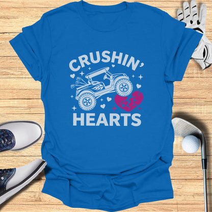 Blue t-shirt with "Crushin' Hearts" text and a golf cart graphic.