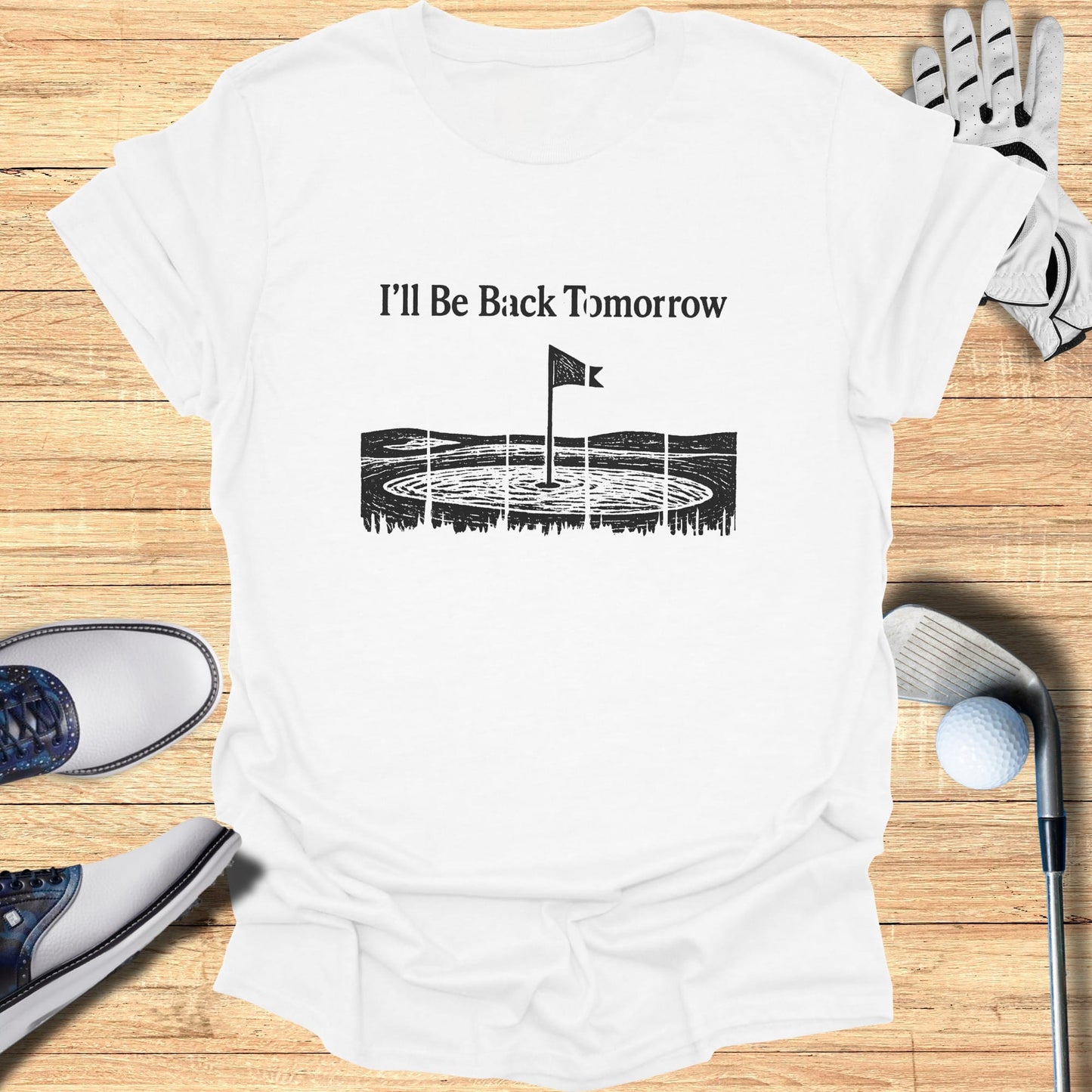White t-shirt with "I'll Be Back Tomorrow" text and golf graphic.