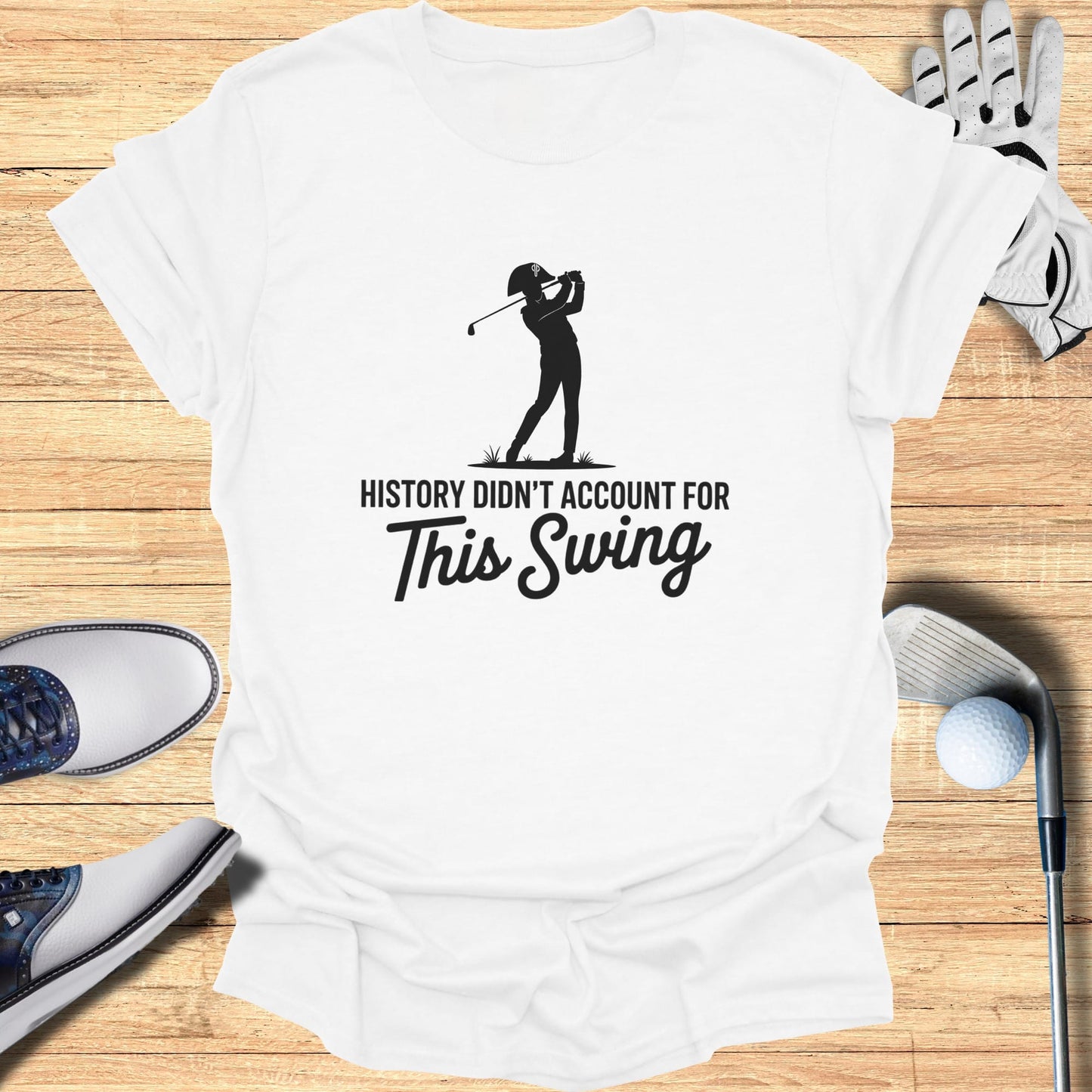 White t-shirt with black text "History Didn't Account For This Swing".