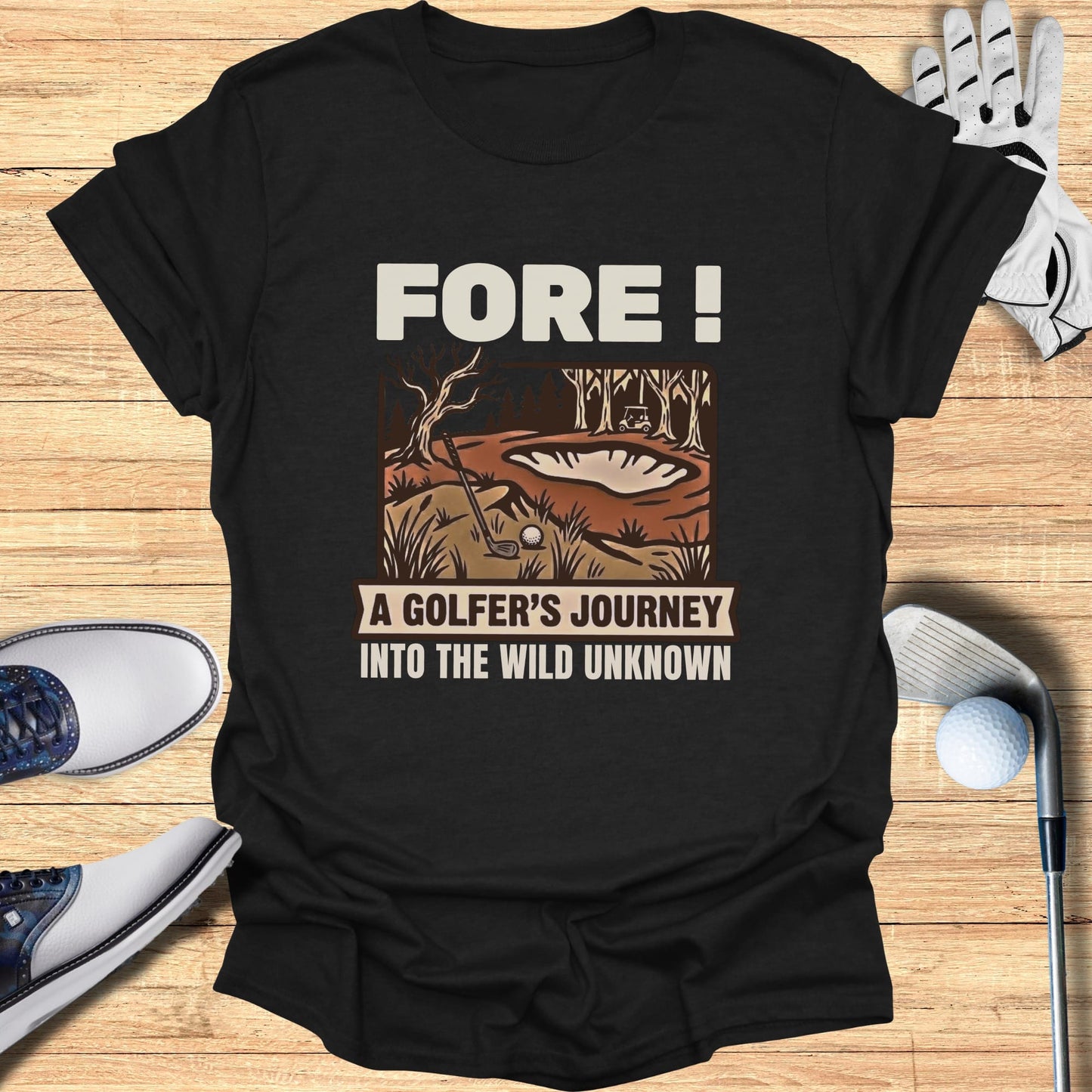 Black t-shirt with "Fore! A Golfer's Journey Into The Wild Unknown" text and golf scene.