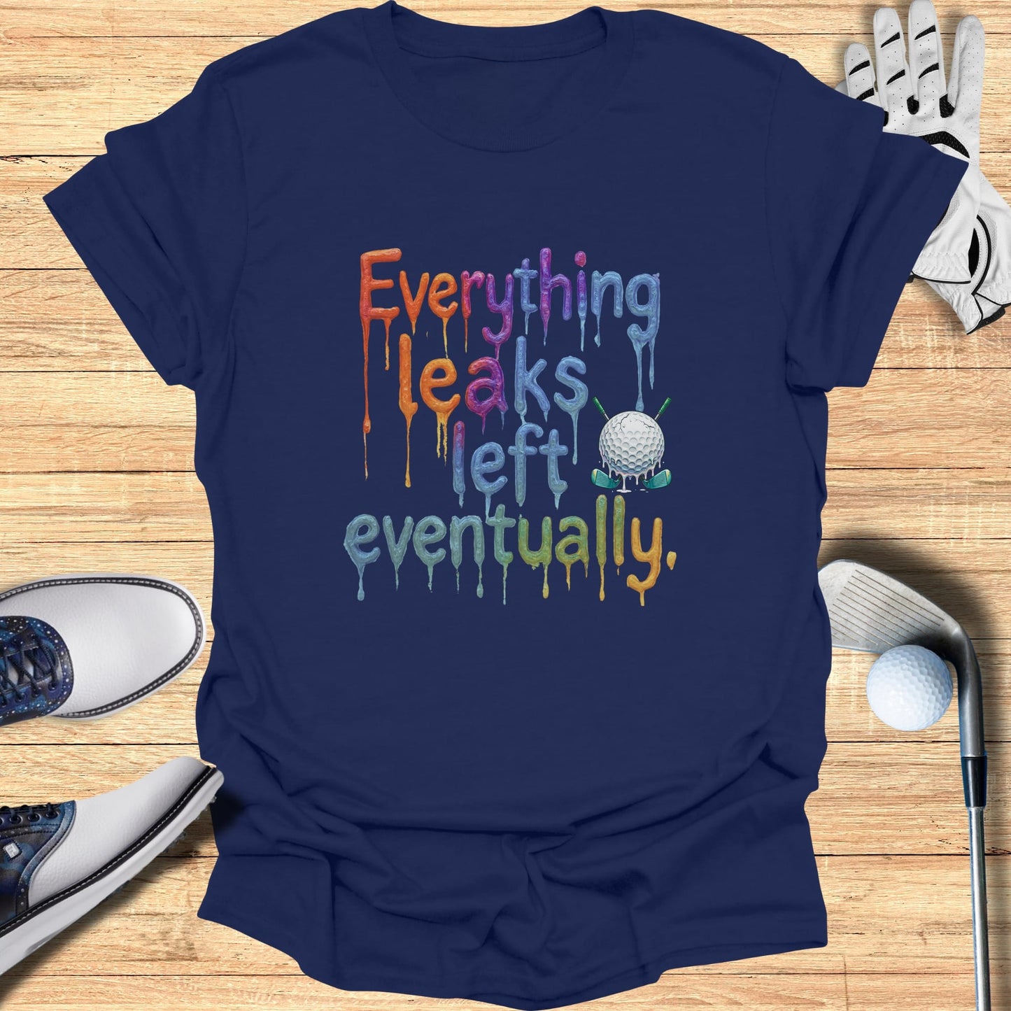 Navy t-shirt with "Everything Leaks Eventually" and a dripping golf ball design.