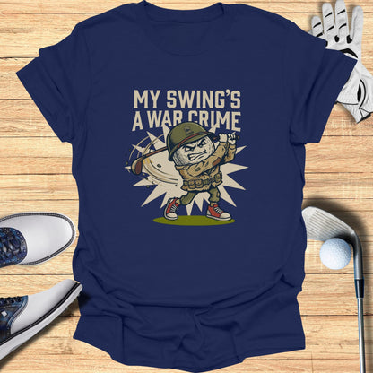 T-shirt graphic of a cartoon soldier swinging a golf club with text "MY SWING'S A WAR CRIME".