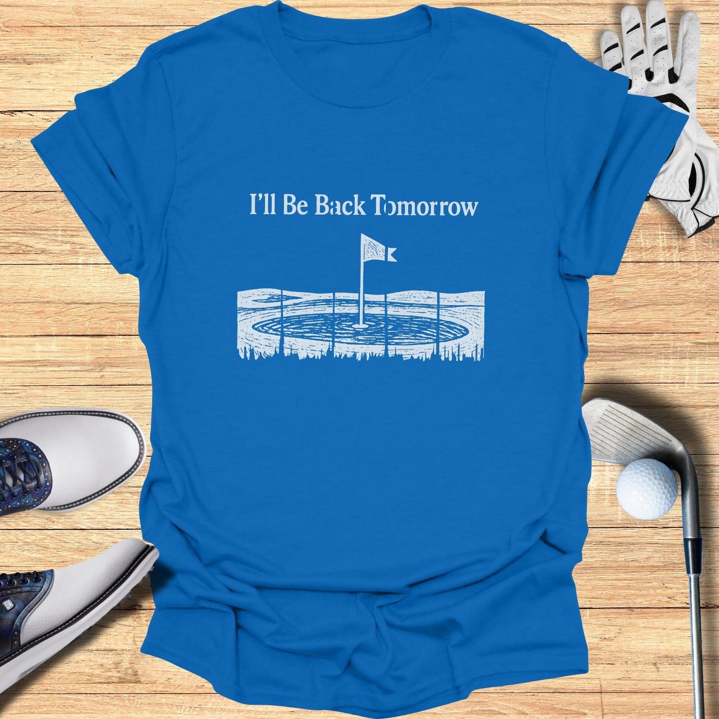 Blue t-shirt with "I'll Be Back Tomorrow" and golf hole illustration.