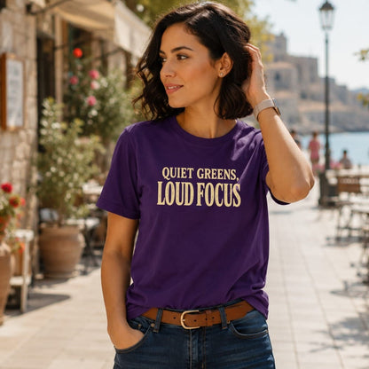Woman in purple t-shirt with "Quiet Greens, Loud Focus" text.