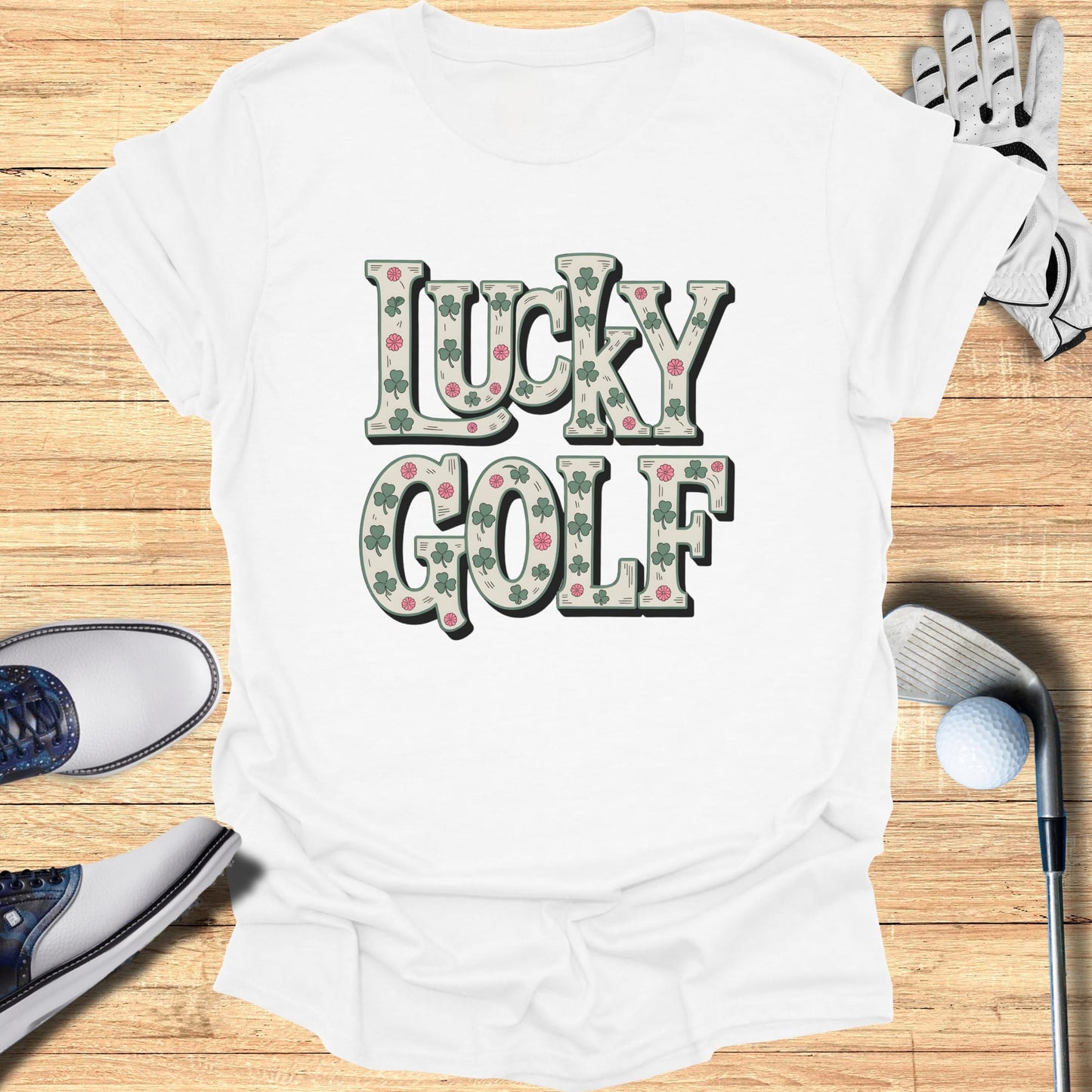 White t-shirt with "Lucky Golf" text and shamrock and rose pattern.