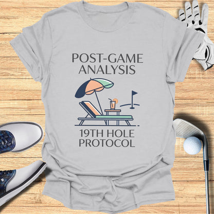 Gray t-shirt with "Post-Game Analysis 19th Hole Protocol" and golf scene graphic.