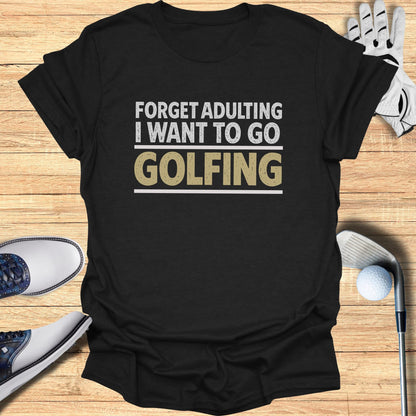 Black t-shirt with "Forget adulting I want to go golfing" text.