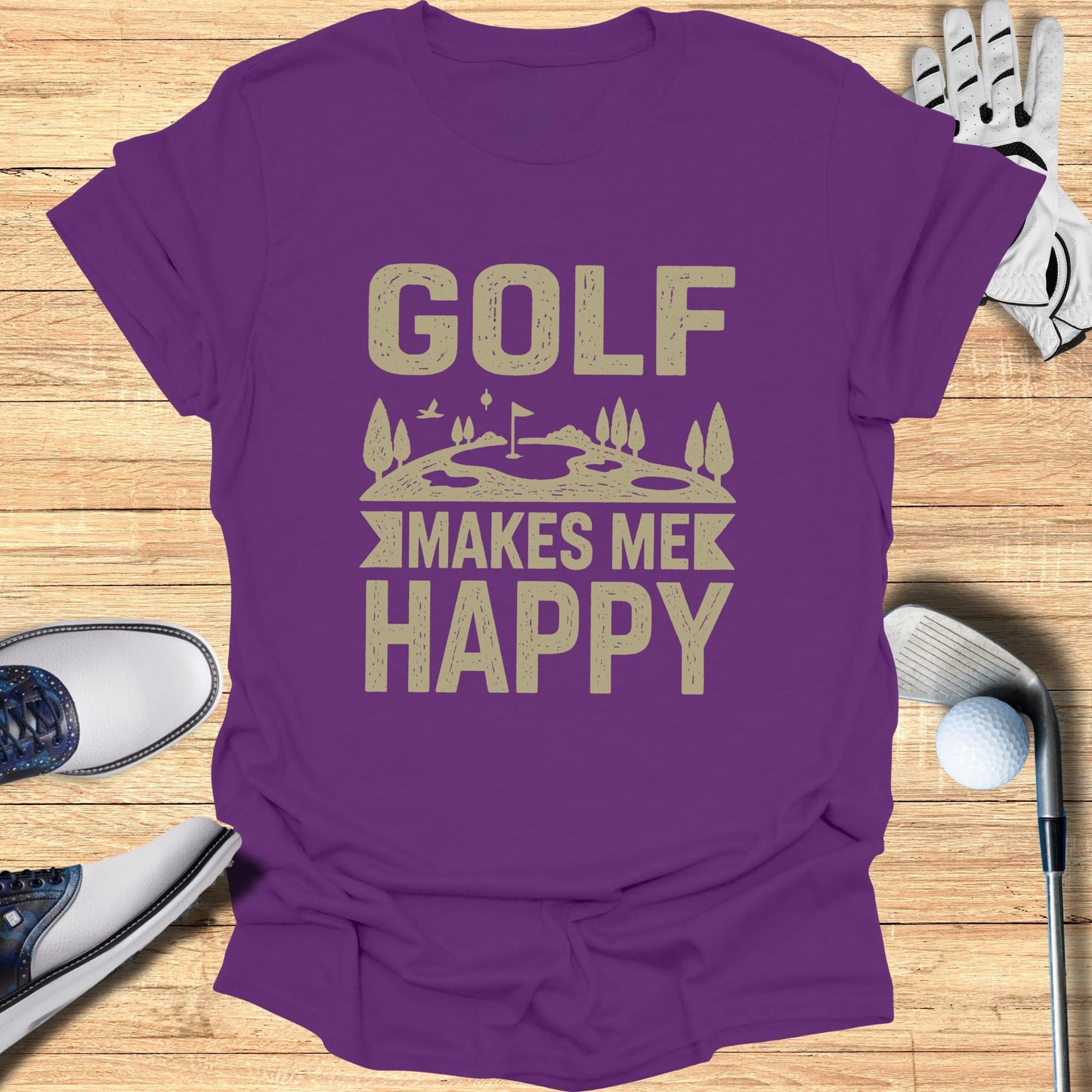 Purple t-shirt with "GOLF MAKES ME HAPPY" text and golf accessories.