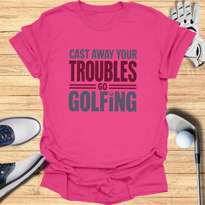 Pink t-shirt with "Cast Away Your Troubles Go Golfing" text.