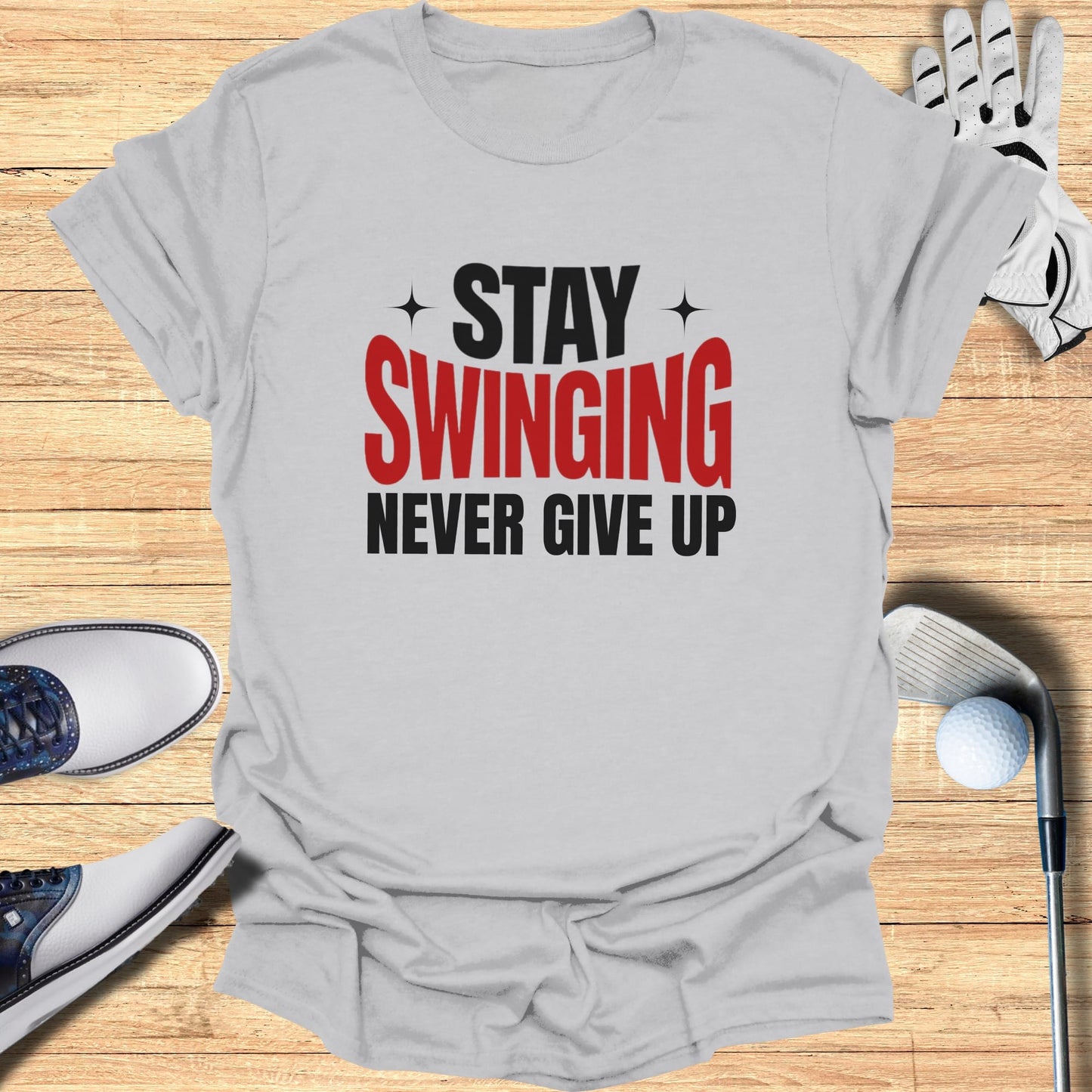 Gray t-shirt with "Stay Swinging Never Give Up" text.