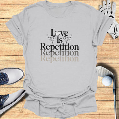 Light grey t-shirt with "Love is Repetition Repetition Repetition" text.
