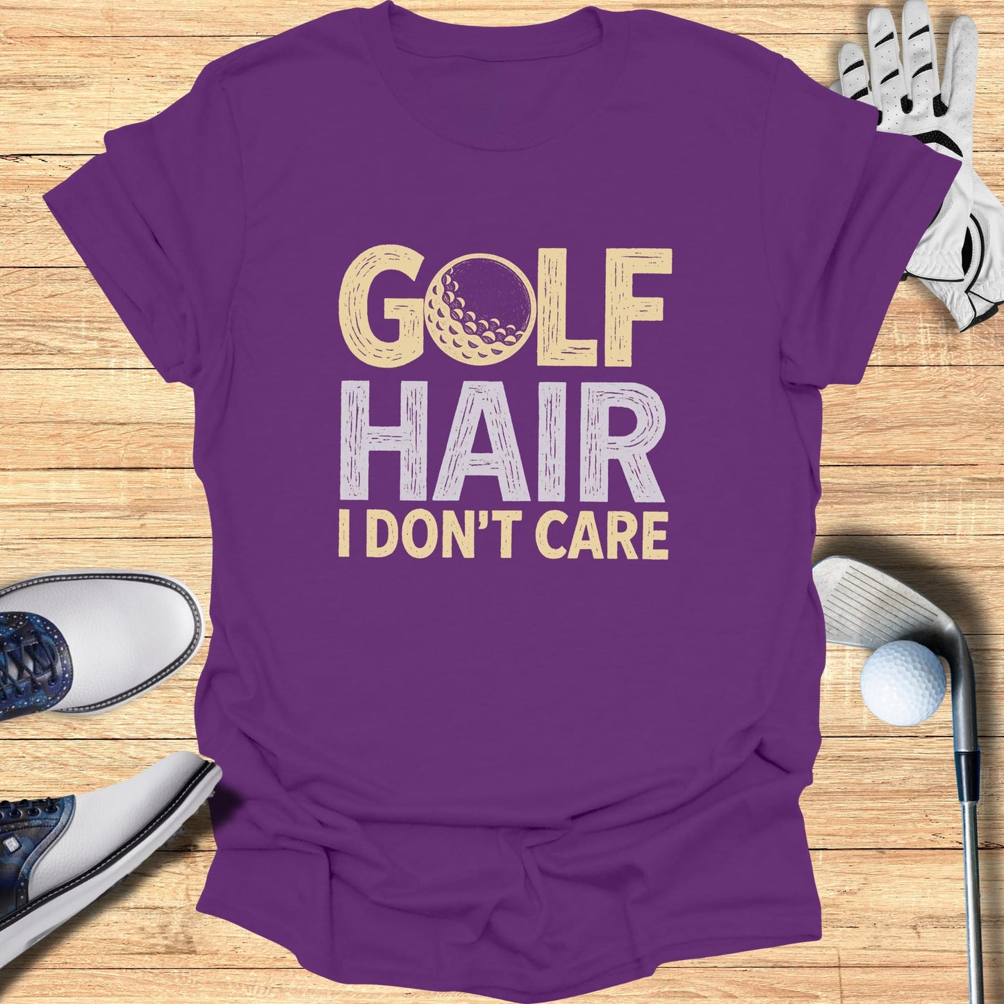 Purple t-shirt with "Golf Hair I Don't Care" and golf ball graphic.
