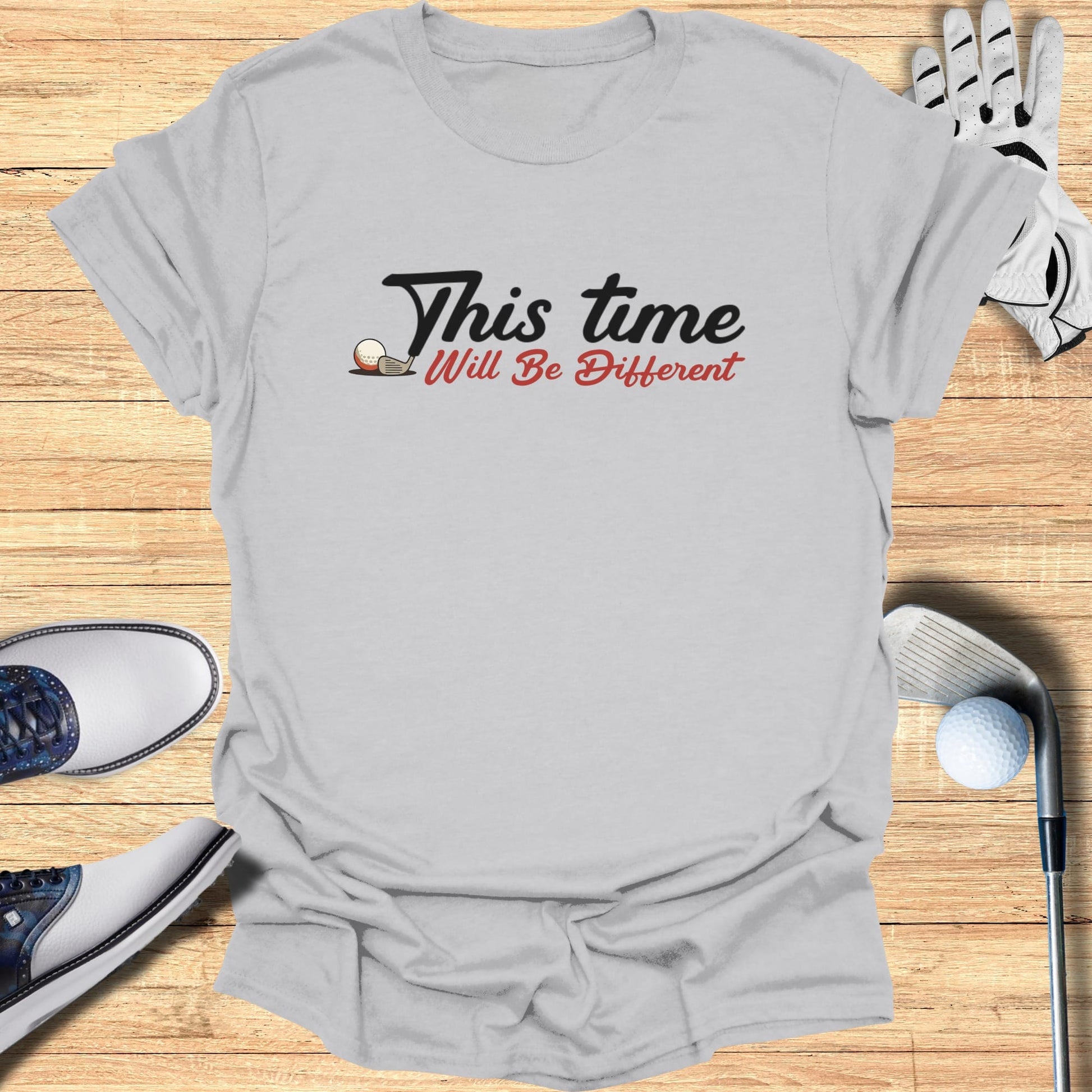 Grey t-shirt with "This Time Will Be Different" text and golf imagery.