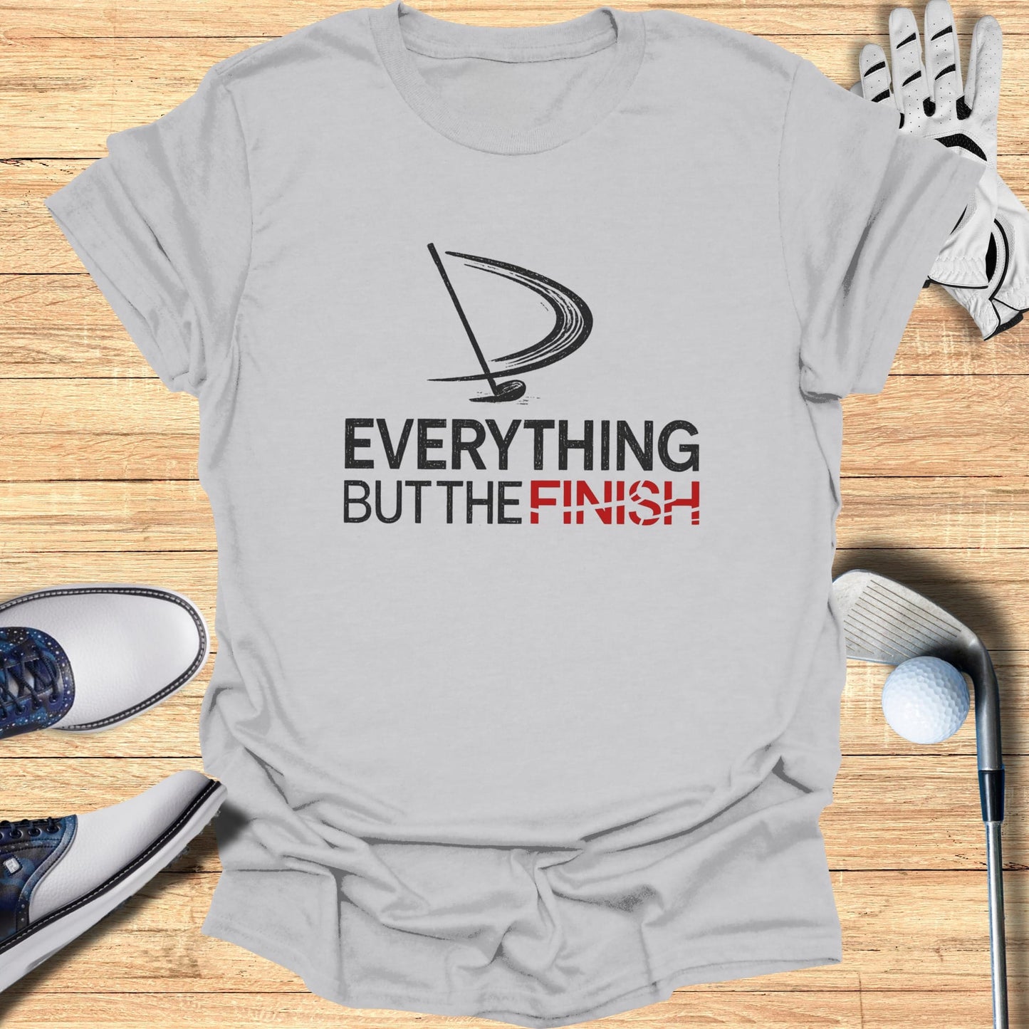 Gray t-shirt with "Everything But the Finish" text and golf imagery.