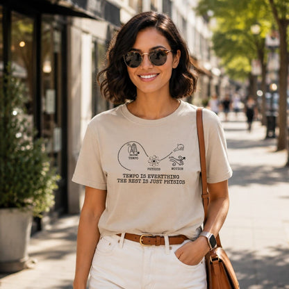 Woman wearing beige t-shirt with "Tempo is everything, the rest is just physics" graphic.
